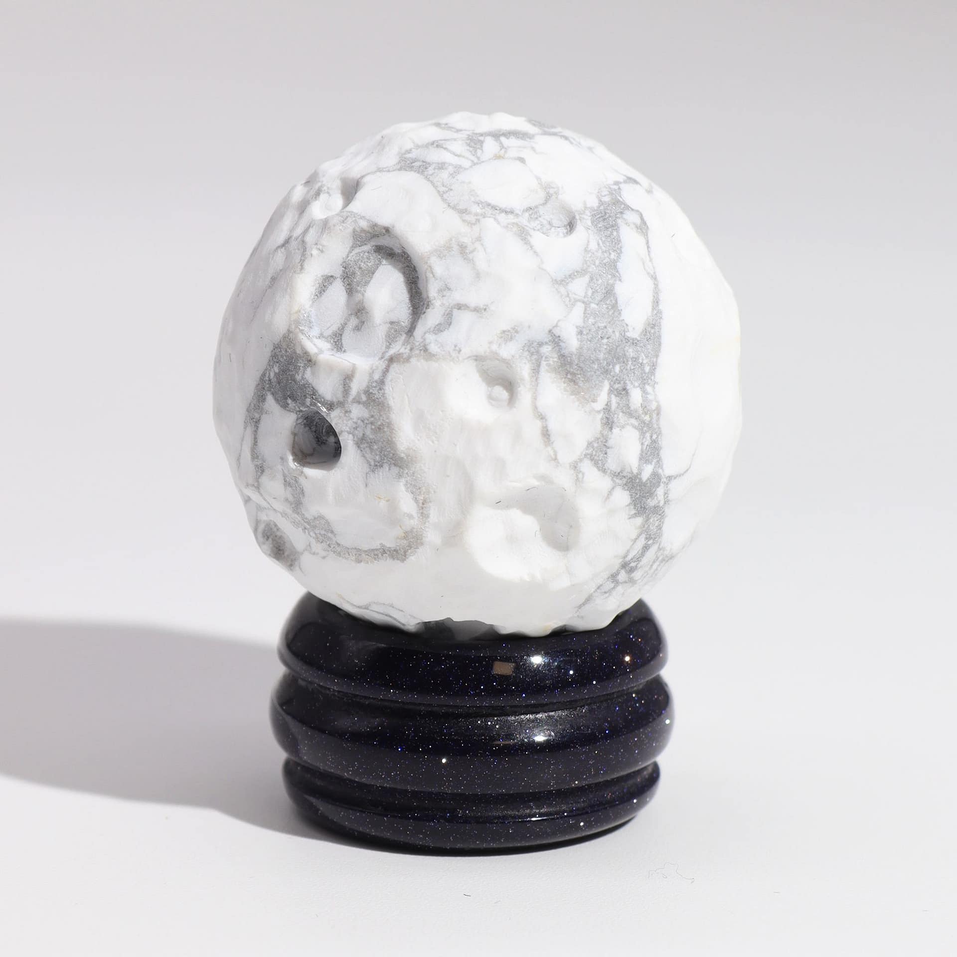 White Howlite Planet on a Sola Goldstone Stand (MOON) 3 White Howlite planet on a goldstone stand, symbolising peace and tranquility.
