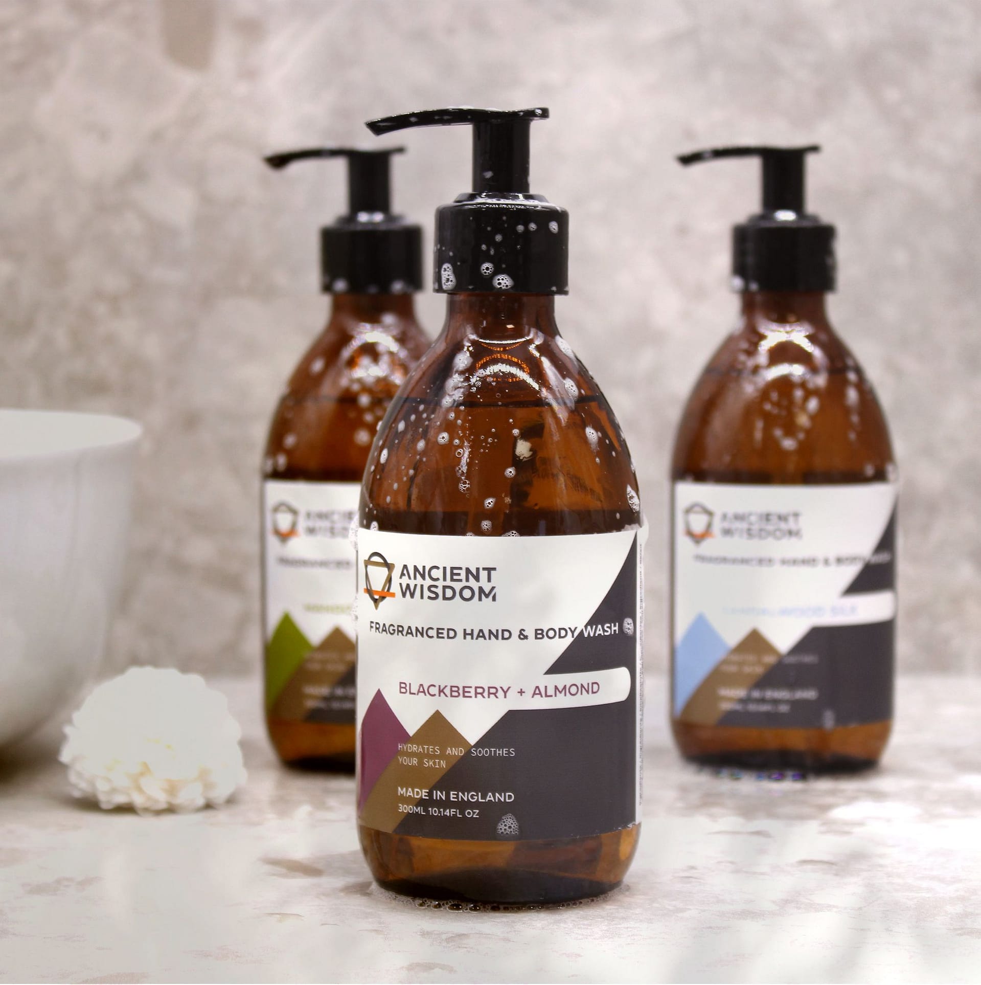 Raspberry & Pomegranate Hand & Body Wash 300ml 2 Raspberry & Pomegranate Hand & Body Wash in a sleek bottle with a vibrant label.
