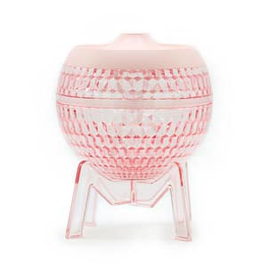 Stylish pink humidifier with colour-changing down light for modern homes.