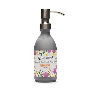Clementine hand and body cream in a stylish jar with a fresh citrus scent.